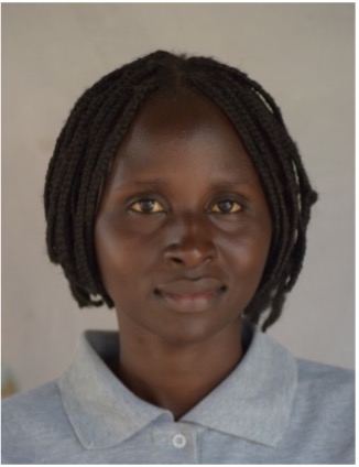A student smiling after graduating from ECU
